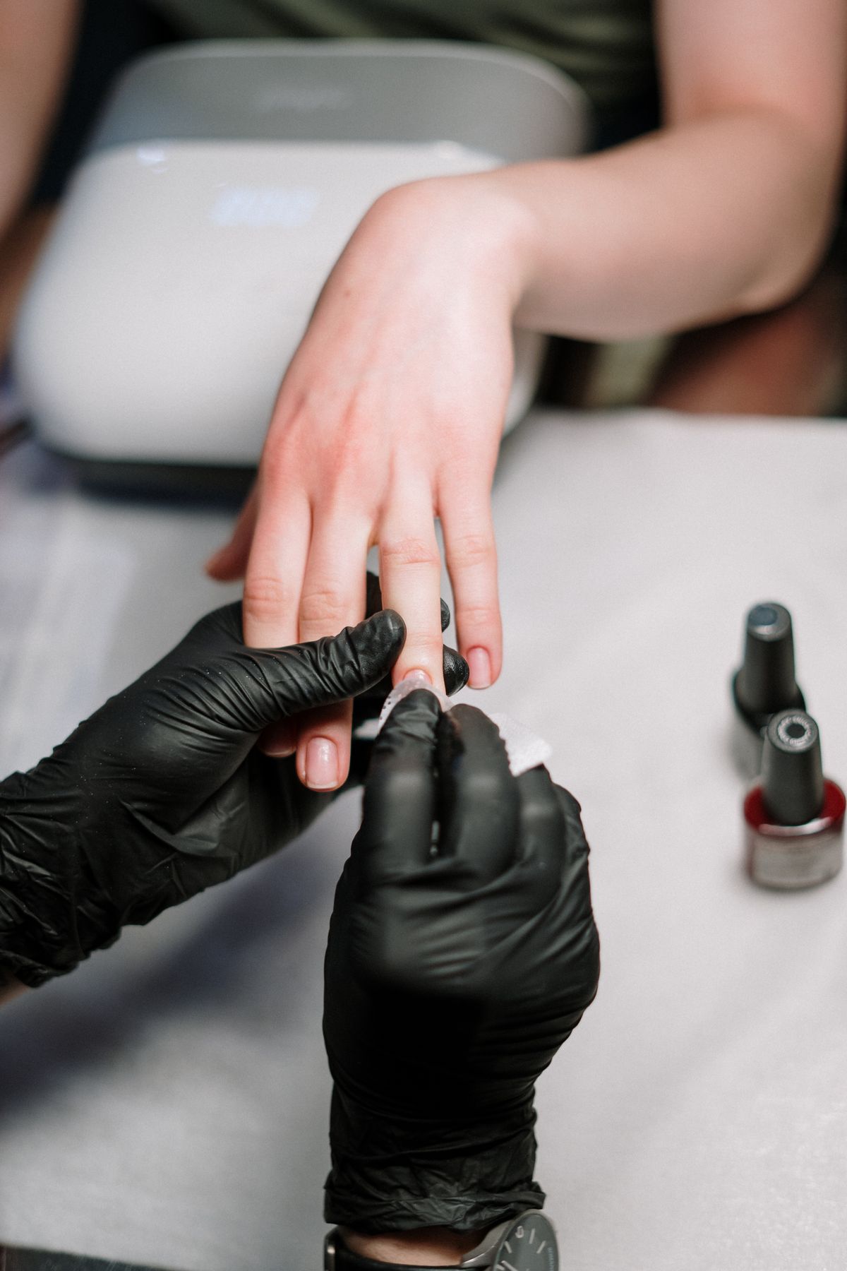 Gel manicure in progress at LizzNails Miami